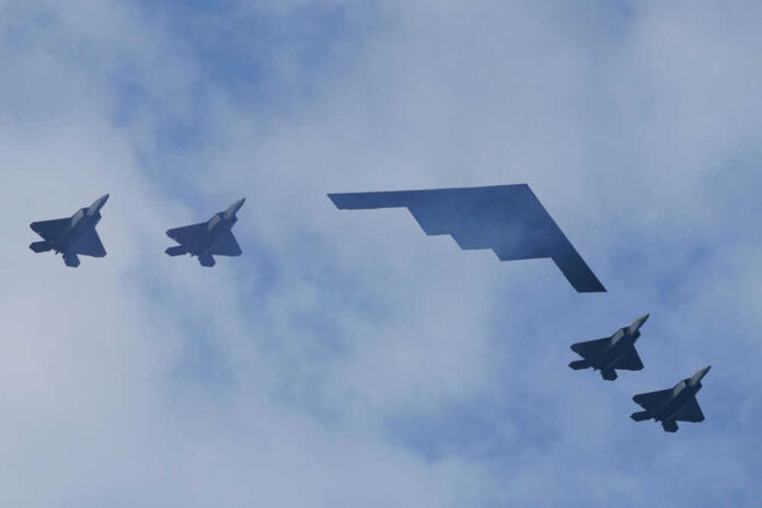 1771974377 Five military aircraft flying in formation under clouds