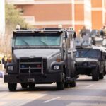 Military Command Overhaul: Trump’s New Battle Plan Military vehicles and personnel in a parade on a city street