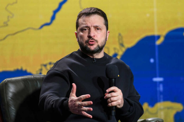 Trump Highlights Zelensky's Peace Commitment at Notre Dame Reopening Event Man speaking into microphone with map background