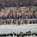 Thousands of Migrants Swim around the Border from Morocco into Ceuta, Spain Thousands of migrants swim around the border from Morocco into Ceuta, Spain