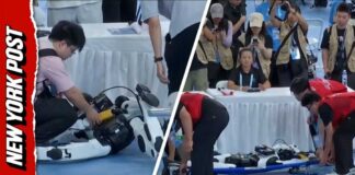 Moment Robot Slams Into Judges’ Table At China World Humanoid Robot Games