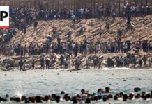 Thousands of Migrants Swim around the Border from Morocco into Ceuta, Spain Thousands of migrants swim around the border from Morocco into Ceuta, Spain